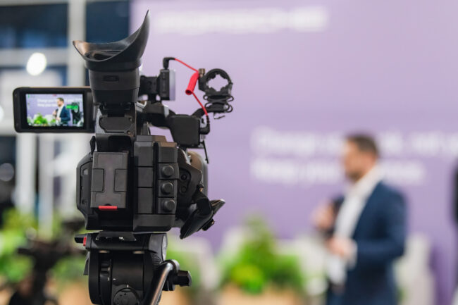 Camera Recording At A Media Press Conference Preserves Accurate Details Of The Event. It Ensures Clear Documentation, Enabling Broader Access To Information And Transparent Communication.